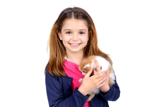 Beautiful young girl posing with a lovely young kitten