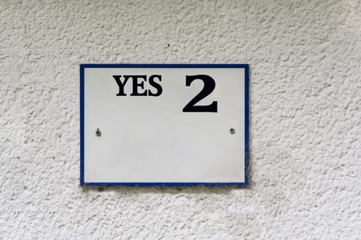 Sign or plaque with the inscription Yes 2..