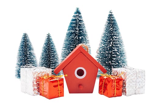 Christmas linear arrangement of birdhouses, trees and gift boxes isolated on white