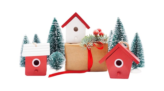 Christmas linear arrangement of birdhouses, trees and gift boxes isolated on white