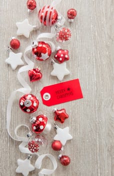 Christmas baubles and other decorations for Christmas on a wooden background