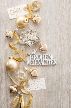 Christmas baubles and other decorations for Christmas on a wooden background