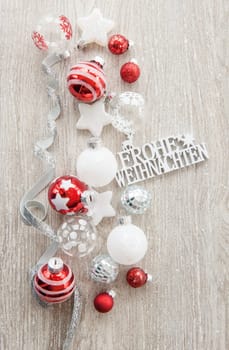 Christmas baubles and other decorations for Christmas on a wooden background