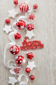 Christmas baubles and other decorations for Christmas on a wooden background