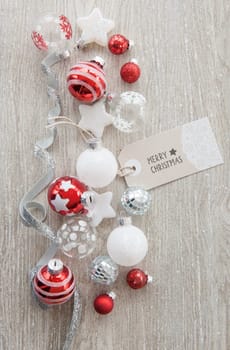 Christmas baubles and other decorations for Christmas on a wooden background