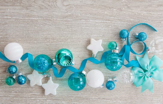 Christmas baubles and other decorations for Christmas on a wooden background
