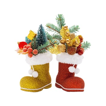 Red and golden boots of Santa Claus with Christmas decorations isolated