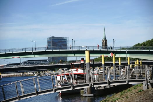 The view over the river Weser and the city of Bremen with buildings and infrastructure.