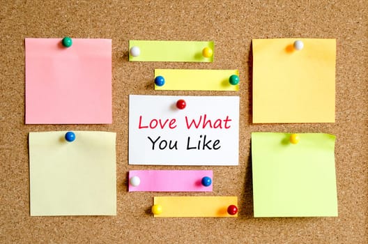 Sticky note on cork board background and text concept