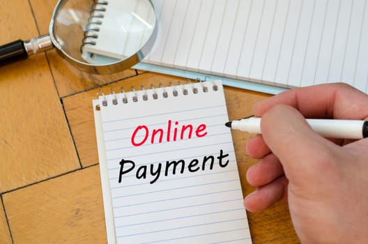 Online payment text concept write on notebook