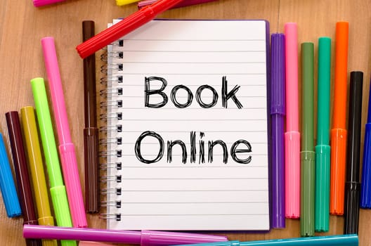 Book online text concept over whiteboard background