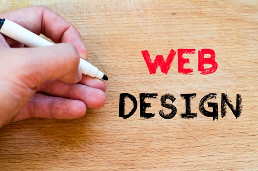 Human hand over wooden background and web design text concept