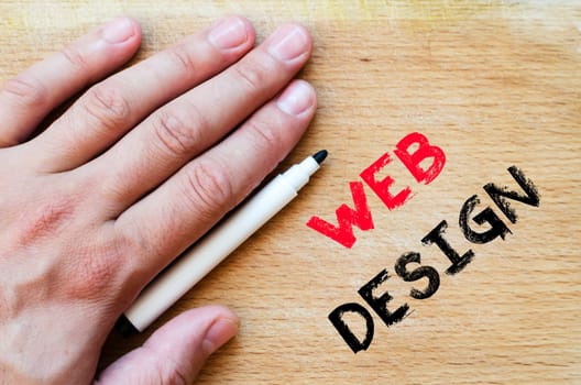 Human hand over wooden background and web design text concept