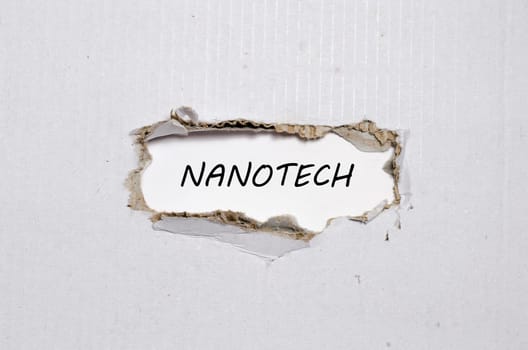 The word nanotech appearing behind torn paper