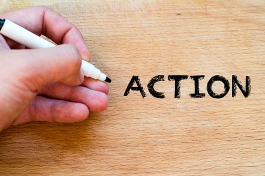 Human hand over wooden background and action text concept