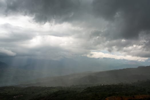 Strong storm over a valley as seen from the town of Barichara, Colombia