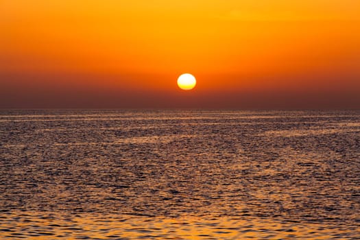 beautiful sunset above the sea.  Colorful sunset over water surface