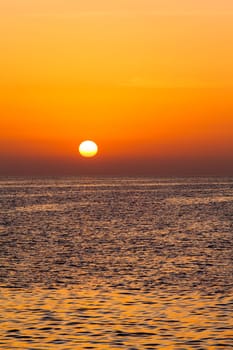beautiful sunset above the sea.  Colorful sunset over water surface