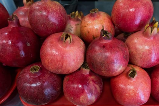 Pomegranates at the Market. Group of pomegranates. Pomegranate closeup, background