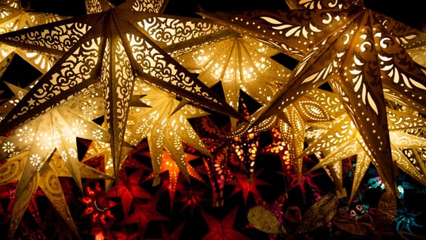 Colorful Christmas stars. A background of star lanterns