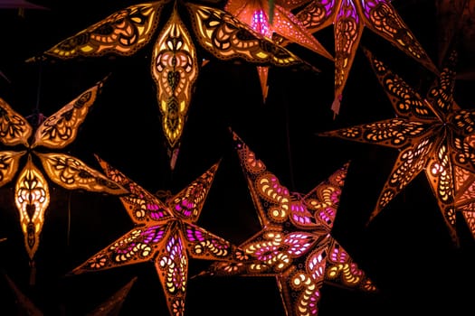 Beautiful christmas market stalls decorations. Colorful Christmas stars at a Christmas Market