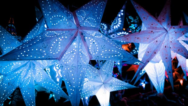 Beautiful christmas market stalls decorations. Colorful Christmas stars at a Christmas Market