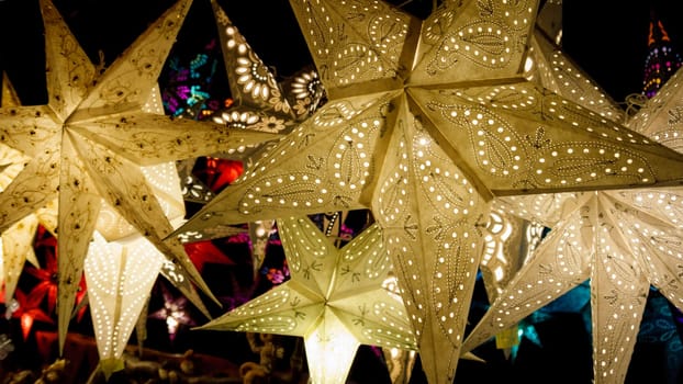 Colorful Christmas stars. A background of star lanterns