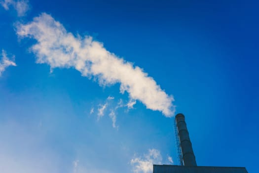 Smoke from smokestack.  Smoke atmosphere emission. Dirty smoke on the sky, ecology problems
