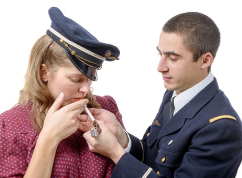 French officer lights a cigarette of young girl in retro style, on white