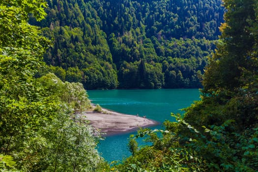 Beautiful landscape with lake, forest and mountains