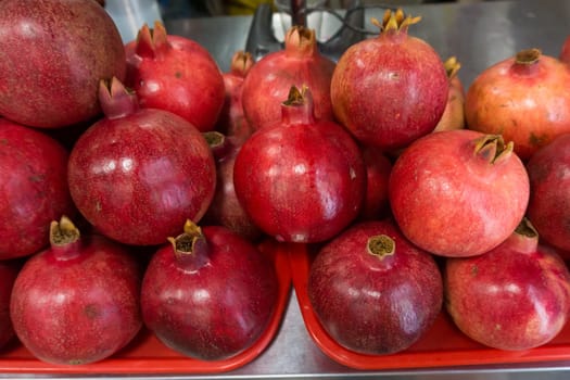 Pomegranates at the Market. Group of pomegranates. Pomegranate closeup, background
