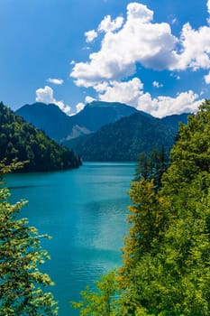 Beautiful landscape with lake, forest and mountains