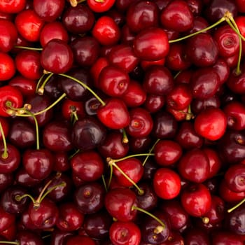 red cherry background.  Red ripe delicious cherries
