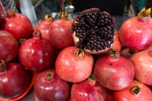 Pomegranates at the Market. Group of pomegranates. Pomegranate closeup, background