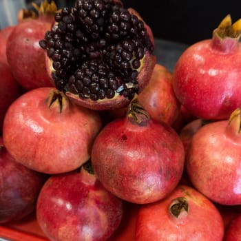 Pomegranates at the Market. Group of pomegranates. Pomegranate closeup, background
