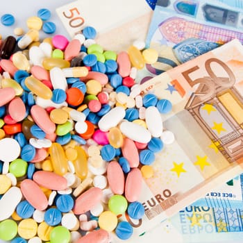 pills on money.  medicine tablets on money