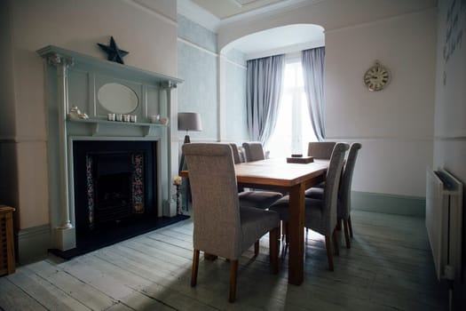 Horizontal shot of an empty dining room.