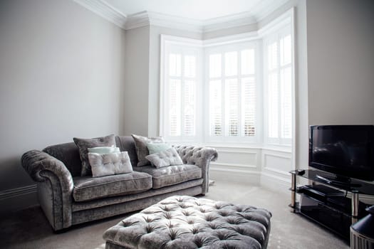 Horizontal shot of an empty living room.