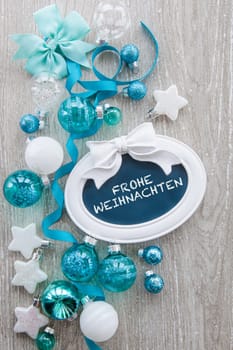 Christmas baubles and other decorations for Christmas on a wooden background
