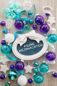 Christmas baubles and other decorations for Christmas on a wooden background