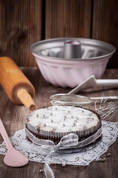 Homemade Christmas cake with baking utensils