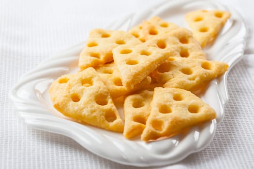 Homemade cheese crackers on white