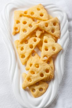Homemade cheese crackers on white