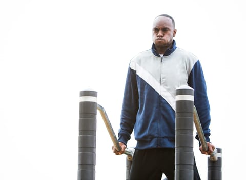 Active black man in training suit exercising at outdoor gym