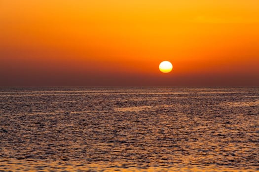 beautiful sunset above the sea.  Colorful sunset over water surface