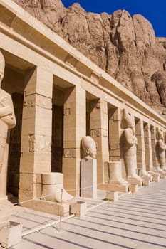 The temple of Hatshepsut near Luxor in Egypt.  Statues on facade of palace of Hatshepsut