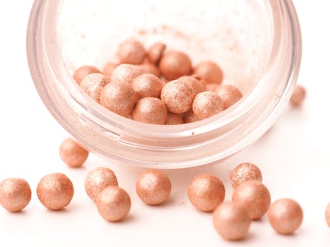 Close up of make up pearls on a bright table, beauty concept image