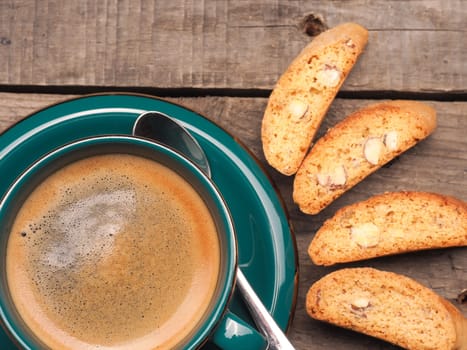 Cup of an espresso with cantuccini, selective focus on the espresso