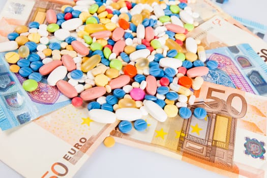 pills on money.  medicine tablets on money