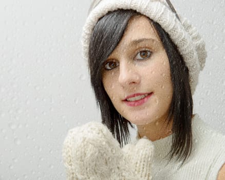 portrait of a pretty young brunette with winter hat